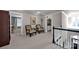 Spacious upper hallway with comfortable seating and views into other rooms at 19577 Meta Rd, Cornelius, NC 28031