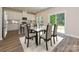 Dining area with glass table and chairs, near kitchen at 1909 Silver Canoe Way, Stanley, NC 28164