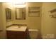 Bathroom with vanity, toilet, and mirror at 1600 H Arlyn Cir, Charlotte, NC 28213