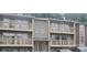Two-story townhome building with balconies and parking at 1600 H Arlyn Cir, Charlotte, NC 28213