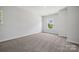 Well-lit bedroom featuring carpet and a window with a view at 133 Jentri Way # 8, Mooresville, NC 28115