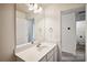 Bathroom with vanity, mirror and access to laundry at 14107 Rory Glen Ln, Charlotte, NC 28215