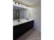 Double vanity bathroom with a large mirror and light at 11521 Allen A Brown Rd, Charlotte, NC 28269