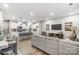 Open concept kitchen and living room with island, white cabinets, and hardwood floors at 4026 Cheyney Park Dr, Charlotte, NC 28269