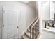 Modern staircase with metal railing connecting floors at 4026 Cheyney Park Dr, Charlotte, NC 28269