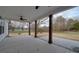 Covered back porch with concrete flooring and wooden support beams at 4020 Landsford Rd, Marshville, NC 28103