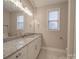 Updated bathroom with granite countertops and white cabinets at 4020 Landsford Rd, Marshville, NC 28103