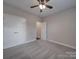Guest bedroom with double doors and carpet flooring at 4020 Landsford Rd, Marshville, NC 28103