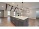 Open kitchen with island, stainless steel appliances, and hardwood floors at 4020 Landsford Rd, Marshville, NC 28103