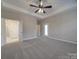 Spacious bedroom with ceiling fan and carpet flooring at 4020 Landsford Rd, Marshville, NC 28103