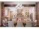 Modern kitchen with white cabinets, brick accents, and an island at 182 Shagbark Ct, Mount Gilead, NC 27306
