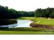 Golf course with pond and trees at 182 Shagbark Ct, Mount Gilead, NC 27306
