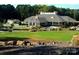Exterior view of clubhouse with landscaping at 182 Shagbark Ct, Mount Gilead, NC 27306