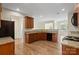Kitchen with granite countertops, wooden cabinets, and black appliances at 1900 Mt Isle Harbor Dr, Charlotte, NC 28214