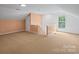 Spacious bonus room with neutral walls and carpet at 1900 Mt Isle Harbor Dr, Charlotte, NC 28214