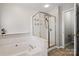 Bathroom with soaking tub and separate shower at 1900 Mt Isle Harbor Dr, Charlotte, NC 28214