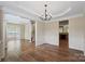 Elegant dining room with chandelier and hardwood floors at 1900 Mt Isle Harbor Dr, Charlotte, NC 28214