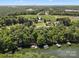 Aerial view showcasing a house near a lake at 1900 Mt Isle Harbor Dr, Charlotte, NC 28214