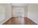 Dining room featuring hardwood floors and bay windows at 1900 Mt Isle Harbor Dr, Charlotte, NC 28214