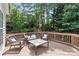 Deck with wicker furniture, creating a relaxing outdoor space at 1900 Mt Isle Harbor Dr, Charlotte, NC 28214