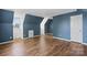 Bonus room with hardwood floors, sloped ceilings, and a window at 1900 Mt Isle Harbor Dr, Charlotte, NC 28214