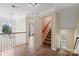 Upper hallway with hardwood floors and access to staircase and bedrooms at 1900 Mt Isle Harbor Dr, Charlotte, NC 28214