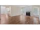 Gathering room featuring hardwood floors, fireplace, and large windows at 1900 Mt Isle Harbor Dr, Charlotte, NC 28214