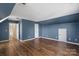 Spacious bonus room with hardwood floors and blue walls at 1900 Mt Isle Harbor Dr, Charlotte, NC 28214