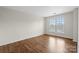 Bright bedroom with hardwood floors and two windows at 1900 Mt Isle Harbor Dr, Charlotte, NC 28214