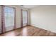 Bedroom with hardwood floors and pink curtains at 1900 Mt Isle Harbor Dr, Charlotte, NC 28214