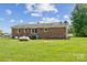 Brick house exterior showcasing a large backyard at 37 Clemmons Rd, Wadesboro, NC 28170