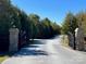 Stone pillars and gate marking the entrance to a community at 8825 Wingard Rd, Waxhaw, NC 28173
