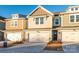 Front view of townhouses with attached garages at 136 Halite Ln, Waxhaw, NC 28173