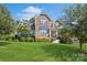 Two-story home with stone accents and a landscaped lawn at 17011 Alydar Commons Ln, Charlotte, NC 28278