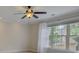 Bright bedroom with large window and ceiling fan at 2331 Carmel Rd, Charlotte, NC 28226