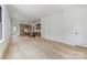 Open living room with hardwood floors and kitchen view at 2112 Kirkwood Ave, Charlotte, NC 28203