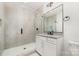 Bathroom with a large shower, vanity, and granite countertop at 2112 Kirkwood Ave, Charlotte, NC 28203