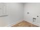 Laundry room with washer/dryer hookups and built-in shelving at 2112 Kirkwood Ave, Charlotte, NC 28203