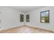 Spacious bedroom with hardwood floors and large windows at 2112 Kirkwood Ave, Charlotte, NC 28203