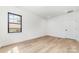 Bright bedroom with hardwood floors and large window at 2112 Kirkwood Ave, Charlotte, NC 28203