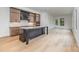 Modern kitchen with island, stainless steel appliances, and light wood cabinets at 2112 Kirkwood Ave, Charlotte, NC 28203