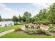 Landscaped firepit area with lake views at 160 Beacon Dr # D, Mooresville, NC 28117