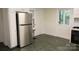 Stainless steel refrigerator in a white kitchen at 35 E Catawba St, Belmont, NC 28012