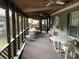 Relaxing screened porch with seating area, perfect for enjoying the outdoors at 103 Holly Harbor Trl # A348, Mount Gilead, NC 27306