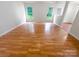 Dining area with hardwood floors and access to kitchen at 9828 Northwoods Forest Dr, Charlotte, NC 28214