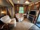 Spacious living room with two recliners and a fireplace at 113 Hummingbird Cir, New London, NC 28127