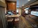 Open kitchen with breakfast bar and dining area at 113 Hummingbird Cir, New London, NC 28127