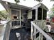 Exterior view of home with screened porch and steps at 113 Hummingbird Cir, New London, NC 28127