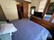 Bedroom with a queen bed, dresser, and access to the bathroom at 113 Hummingbird Cir, New London, NC 28127