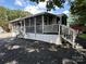 Mobile home exterior with large screened porch at 113 Hummingbird Cir, New London, NC 28127